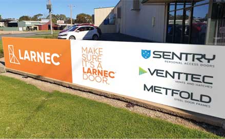 Larnec's banner beside office
