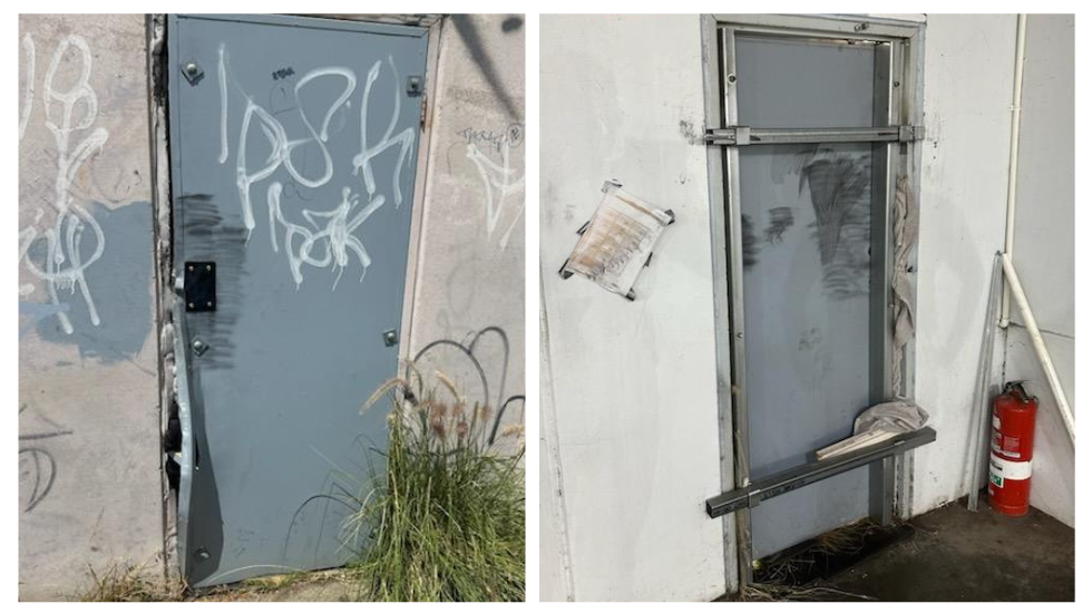 A damaged metal door covered in graffiti, emphasizing the need for secure commercial doors to prevent unauthorized access