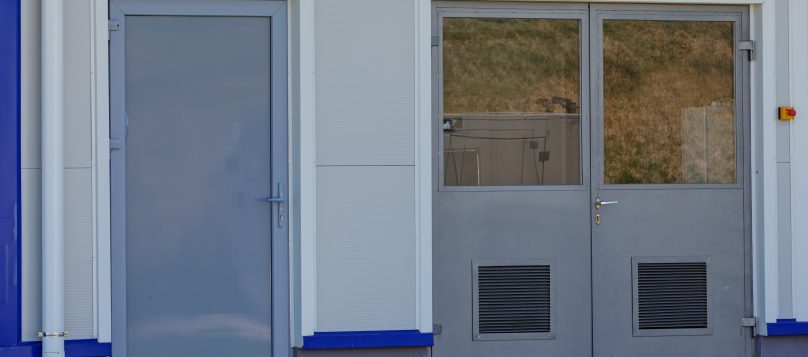 A shipping container with both single-leaf and double-leaf doors, demonstrating door options for industrial use