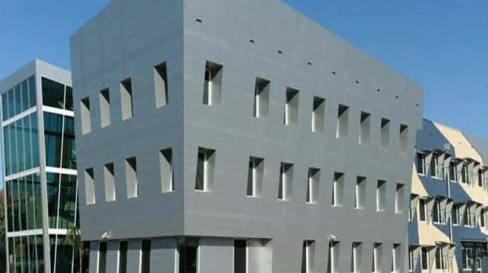 Modern commercial office building with a minimalist facade, reflecting a professional workplace environment