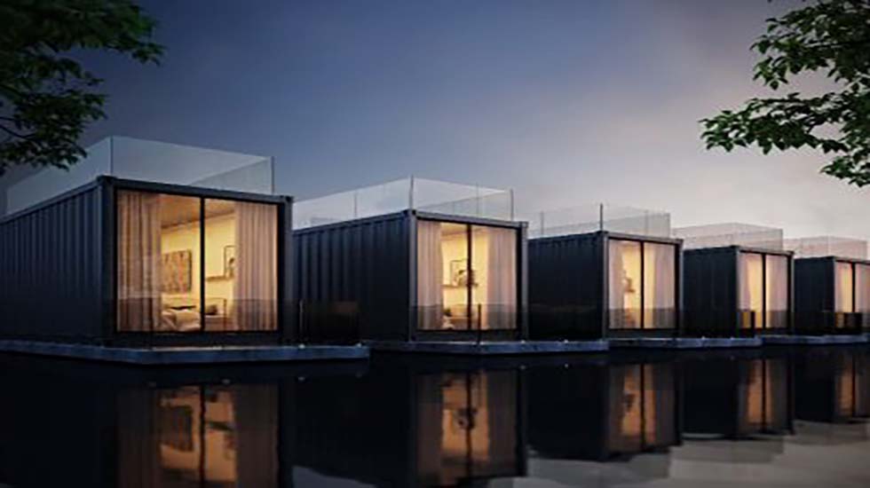 Modern shipping container buildings repurposed into contemporary living spaces, illuminated at dusk.