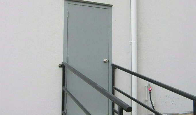 An exterior steel-clad door with safety rails for easy accessibility.